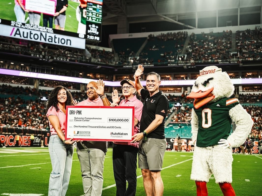 Marilité Vazquez-Gonzalez, senior marketing director at AutoNation; Jeff Butler, president of AutoNation Finance; Dr. Stephen Nimer, director of Sylvester Comprehensive Cancer Center; and Javier Sanchez, executive director of the Dolphins Cancer Challenge