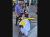 Ryan, Annie and patient GG Christopherson cheer from the sidelines during the Go Gold Parade.