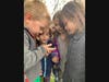 Children looking at something picked up on a nature walk.