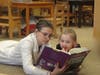  Teacher reading to a child.