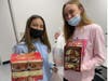 Genna Jardim & Francki Breedlove collect goods at Howell High School