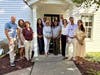 The Guilford Foundation Board of Directors and Executive Director Liza Janssen Petra outside the Foundation's headquarters at 44 Boston Street before a recent board meeting.