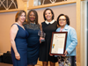 Jack and Jill of America, Inc.- Westchester County New York Chapter members pose with Jennifer Ryan Safsel, CEO of the New Rochelle YMCA and Westchester County Legislature Terry Clements.