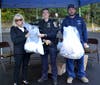 (From left) Police Commissioner Angela Mullins, Police Officer Emma Nadel, and a representative from the Port Washington Water District collect unused and expired medications during the October 22 “Shed the Meds” event.

