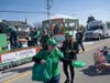 Smith Crossing executive director Amanda Mauceri distributes frisbees to parade crowds.