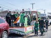 Residents sing on 60 foot long custom built float.
