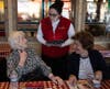 Bea Slattery and Gloria French place their order with Allie Grossman from Portillos. 