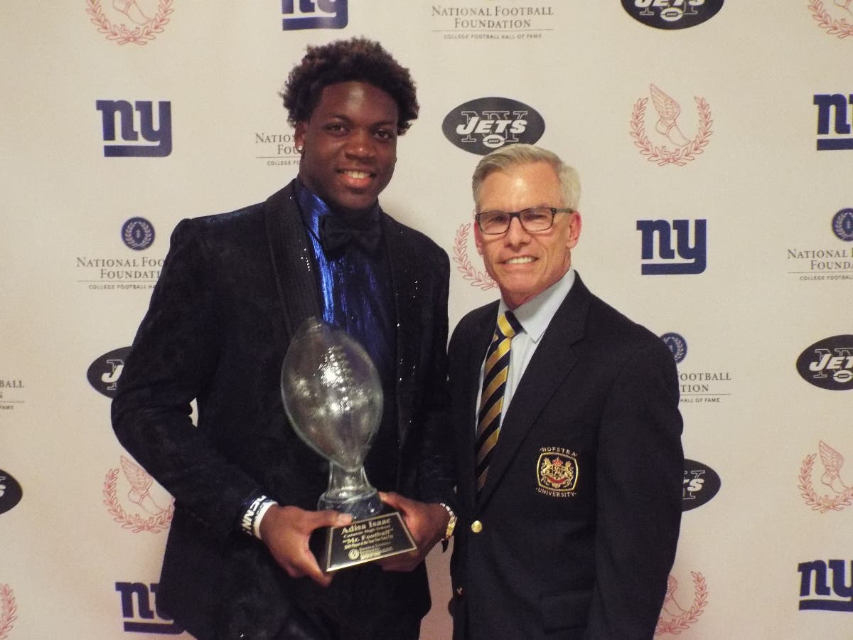 Adisa Isaac, Mr. Football New York City, with James C. Metzger at the "Elite Eleven" Scholar Athlete Awards Banquet.