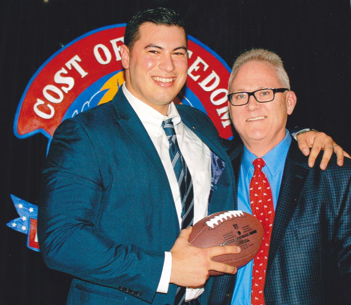 Matias Ferreira (left), a military veteran and Suffolk County police officer, with E. David Woycik. 