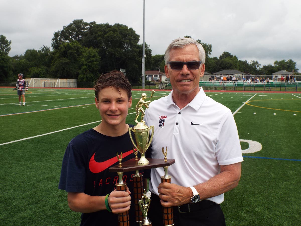 Midfielder Owen Wuchte of Garden City High School received the Long Island Lacrosse Showcase most valuable player award from lacrosse benefactor James C. Metzger.
