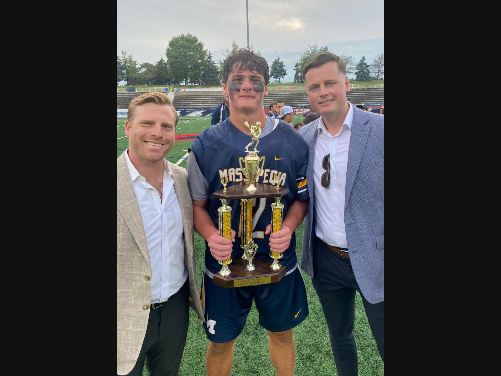Junior midfielder/attackman Nolan Wieczorek, Massapequa High School, received the James C. Metzger MVP Award from local lacrosse all-stars and All-Americans James Pannell and Jack Concorran at the Class A 2026 Long Island Boys Lacrosse Championships.