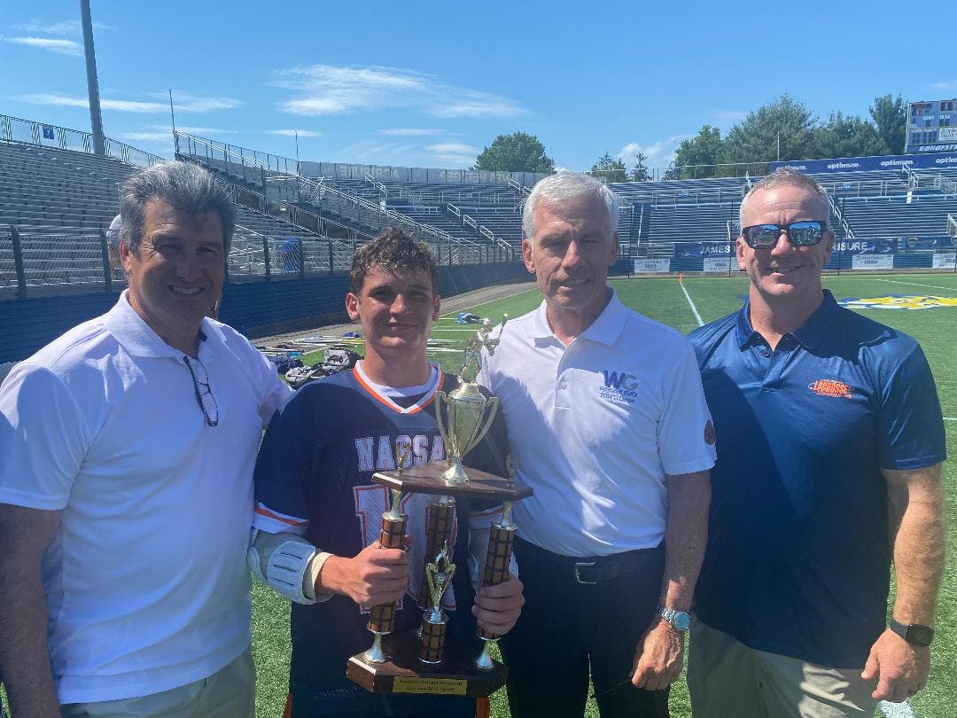 From left: Vincent Sombrotto, Nassau County Rising Seniors Most Valuable Player Will Nabet, James C. Metzger and Eric Dunne.
