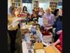 DAR members fill Valentine decorated care package boxes with essentials and treats.