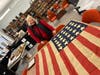 Regent Judy Carey views a 25 Star flag from 1836 at the Yorktown Museum 