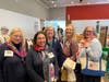 Members of the Polly Cooper Chapter congratulate Alison