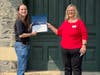 Kim Mcrea hands DAR Historic Preservation Award to Rowan Tucker 