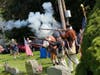 Historical Renactors give a rifle salute to honor John Peterson