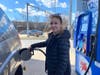  Lisa Walker, 38, of Wayne, fills up her tank Thursday at the Mobile on Valley Forge Road, Tredyffrin Township. The mother of four cuts back on driving and looks for rewards amid the gas crisis.