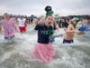 Shamrock Splash participants as they plunge into the cold water at Constitution beach.