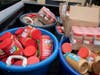 Tubs of donated peanut butter for the Peanut Butter Challenge.