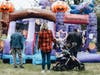 The family fun at Harvest Fest includes multiple bounce houses such as this.