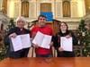 (Left to Right) Rev. Dr. Pat Kriss, Robert Botelho, Heidi Palmer present the signed contract between the First Congregational Church and Deer Hill Regency.