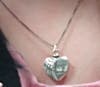 Reeves' locket, which contains some of ashes of her daughter Tiffany