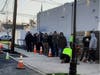 The line to buy recreational marijuana at Curaleaf’s location in Bellmawr at about 7:20 a.m. Thursday. Within a half hour, the line had extended around the corner of the building.