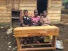 The school needs more desks due to increased enrollment.