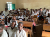 Dan Torsiello and his girlfriend, Jackie, sitting in one of the classrooms they have helped to rebuild in Mushaki, DR Congo.