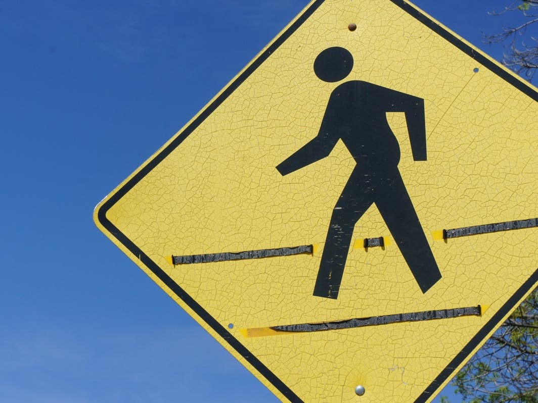 The flashing signs would improve safety, according to officials.