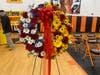 This memorial wreath, made by Barnegat's Rose Garden Florist for free, showcases the colors of both the American flag and South Vietnamese flag.