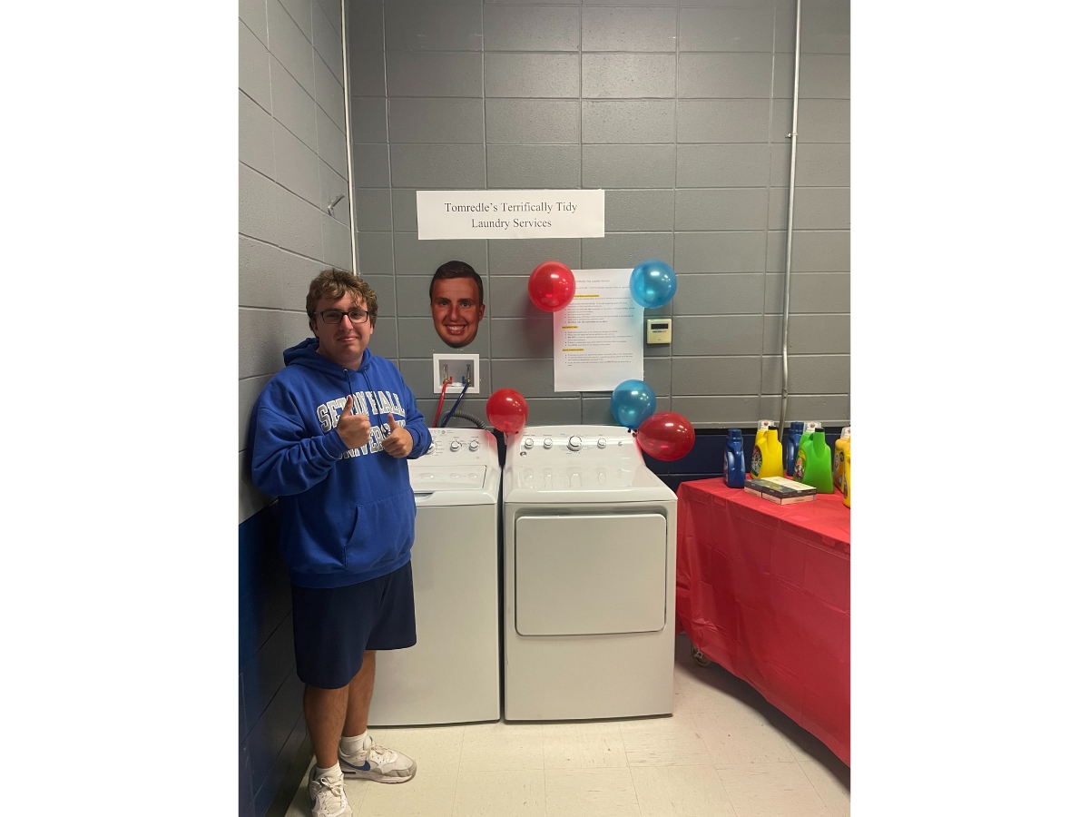 Jimmy Tomredle stands with Tomredle's Terrifically Tidy Laundry Services.