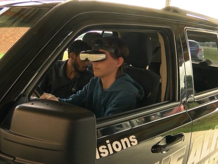 A student using an Arrive Alive Tour driving simulator during the Happy Valley High School in Elizabethton, Tennessee tour date. 