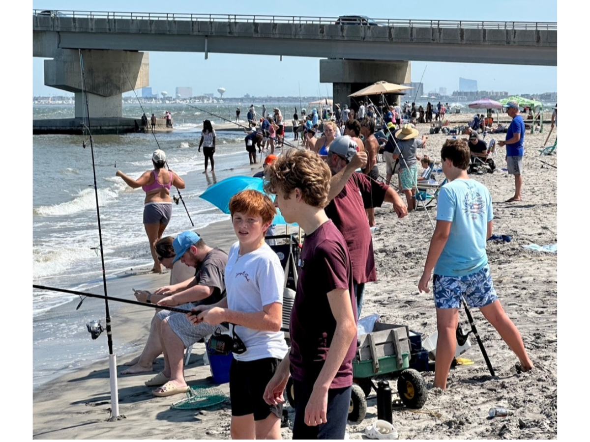 Crowds line the waterfront at the base of the Ocean City-Longport bridge to participate in the Ocean City Fishing Club's 47th Annual Boys and Girls Surf Fishing Tournament that was held Saturday.