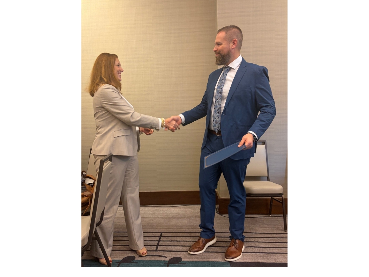 BTSD Superintendent Dr. Brian Latwis shaking hands AASA member Kimberly Saunders after receiving his AASA National Superintendent Certification Program certificate. 