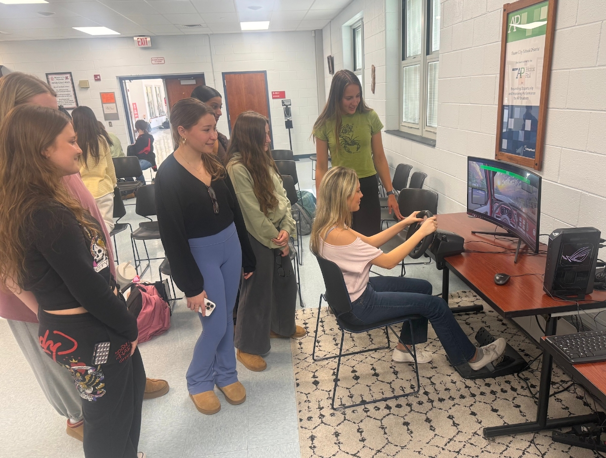 Ocean City High School students use a driving simulator to understand the risks of driving while impaired. 