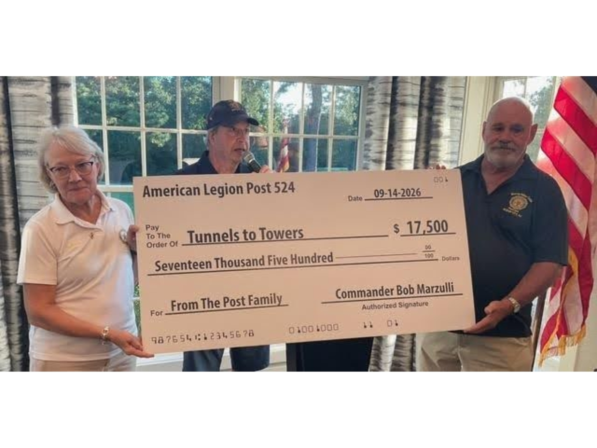 Ocean City American Legion Post 524 Commander Bob Marzulli (center) announces the donation of $17,500 to The Tunnels to Towers Foundation during a dinner at Harbor Pines Country Club.