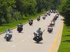 145 bikers come down Munger Road during the 45-mile annual Ride for Hope Ovarian Cancer Motorcycle Ride on July 14, 2024. (Led by Cook County Sheriffs, not shown.) 