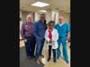 Dr. Jim McGuiness (far left) and Dr. Hal Orenstein (far right) of Parker Family Health Center, together with Pastor Terrence K. Porter of Pilgrim Baptist Church of Red Bank (middle left) and retired nurse Teena Lomack (middle right)