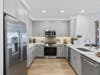 Model residence kitchen at The Pearl at Station Bay