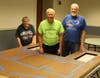 Karen Buikema, Gary Westefer and George Peso in construction of the central portion of the Schoolhouse Playhouse in preparation for the exhibit in September