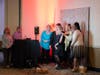 Guests strike a pose for the photo booth camera at St. Coletta’s Caritas Benefit on May 21. 
