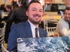 Chris Kowalis of Homer Glen was the winning bidder who took home this original artwork piece created by an individual in St. Coletta’s Creative Expressions group sessions.