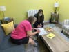 Lauren Mock, director of psychology, works with a participant in one of the updated therapy rooms at St. Coletta's. A grant from Franciscan Health enabled the social service agency to convert two cold, sterile therapy rooms into welcoming spaces.