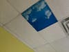 A sky inspired cloth covering softens the glare of fluorescent lighting in St. Coletta's renovated therapy rooms.