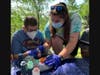 Teamwork, critical thinking and creative expression come into play as Recreational Therapist Stephanie Wingo helps a participant in St. Coletta’s Community Day Services program tie-dye a shirt.