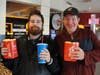 Two participants from St. Coletta’s Community Day Services program get their popcorn and pop before heading in to see “Champions” at Marcus Theater on March 21.