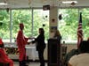 Kennedy School Principal Dawn Angelini hands a certificate of completion to a graduate on May 23. Students will receive diplomas from their home schools.