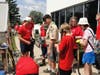 Life Scout Maksym Sierak hands out work gloves to his team of helpers on July 15.